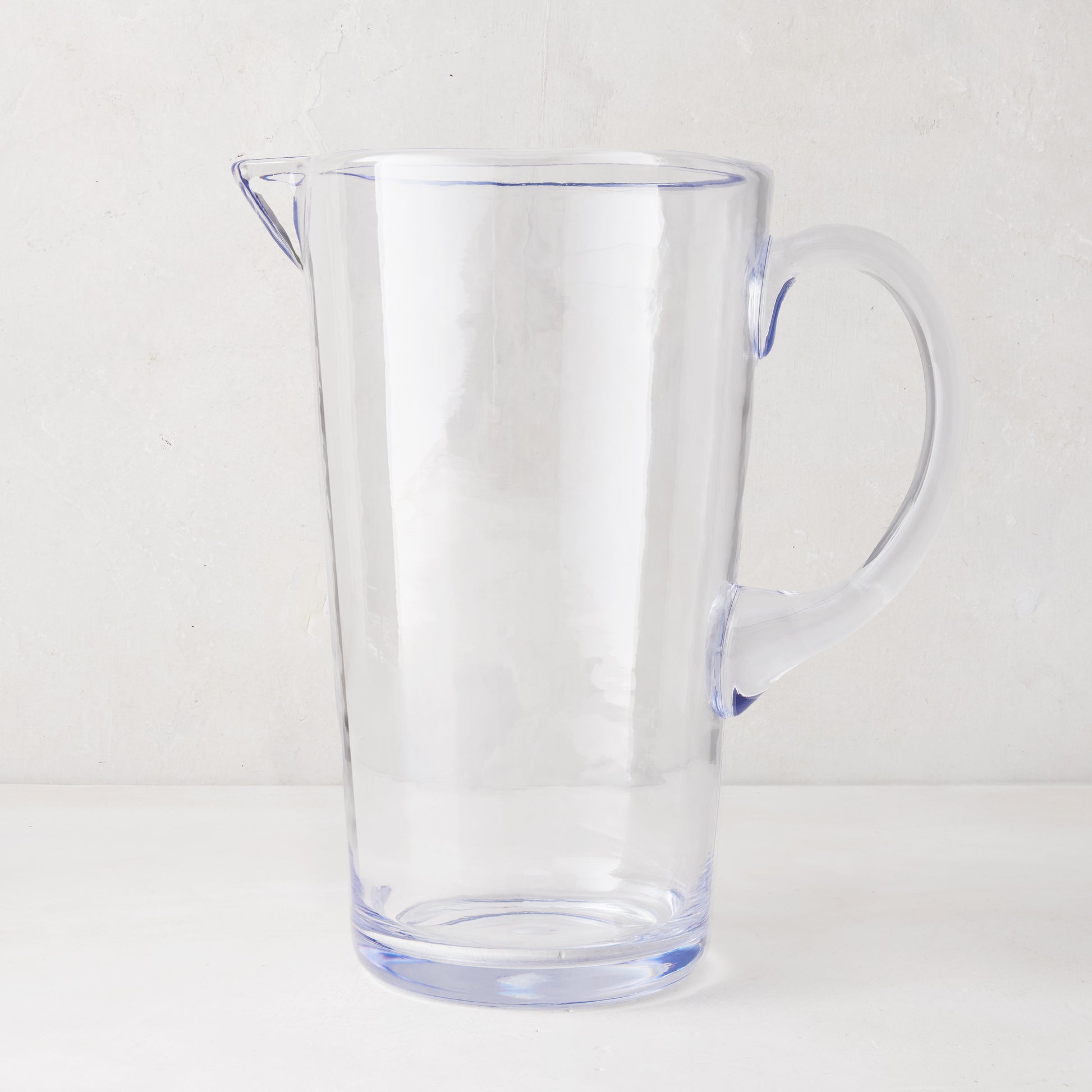 Clear Acrylic Seadrift Pitcher, 70oz, with handle and spout, on a white background.