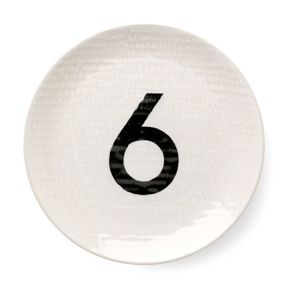Cream ceramic salad plate with hammered finish and black number 6.