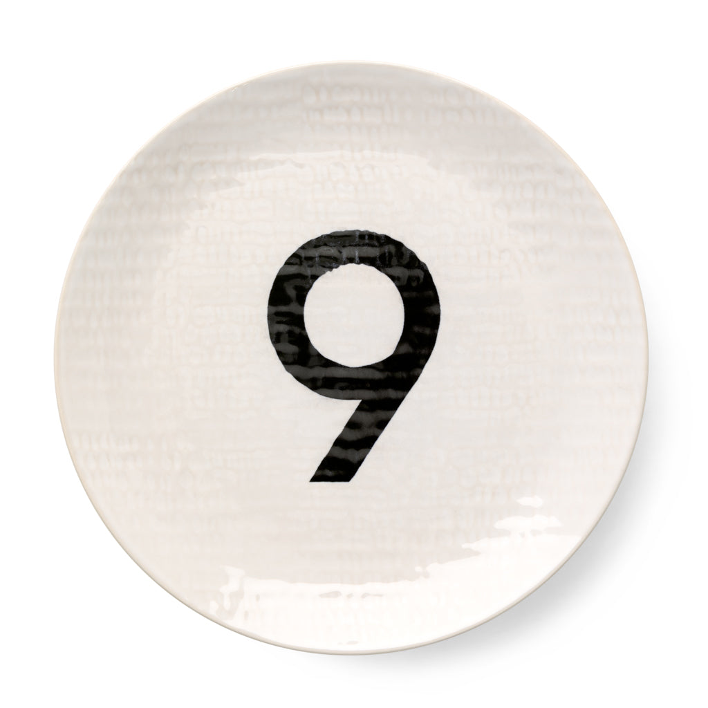 Cream ceramic salad plate with hammered finish and black number 9.