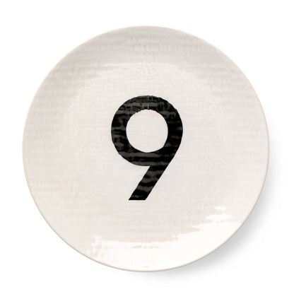 Cream ceramic salad plate with hammered finish and black number 9.