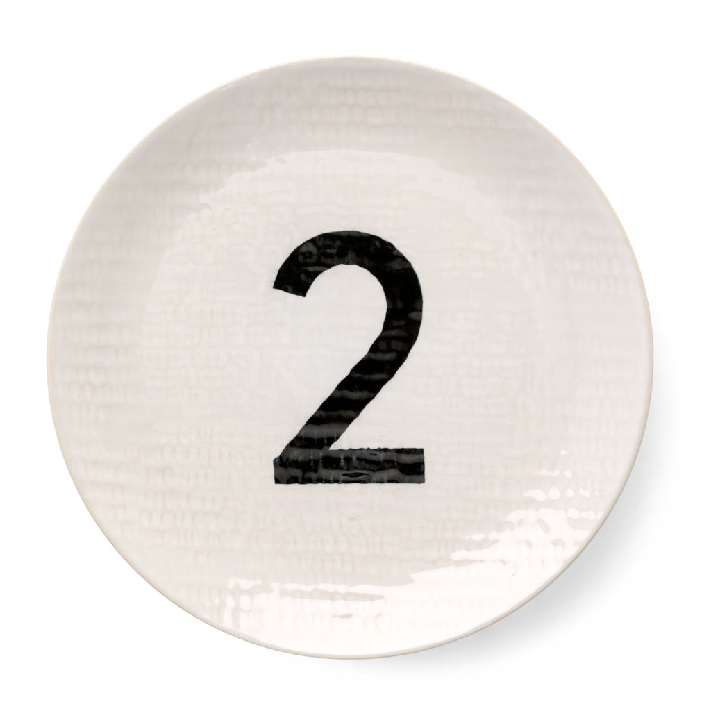 Cream ceramic salad plate with hammered finish and black number 2.