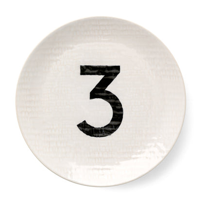 Cream ceramic salad plate with hammered finish and black number 3.