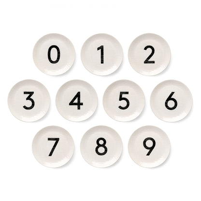 Set of 10 cream ceramic salad plates, 8.5" diameter, with black numbers 0-9 and a subtle hammered texture.