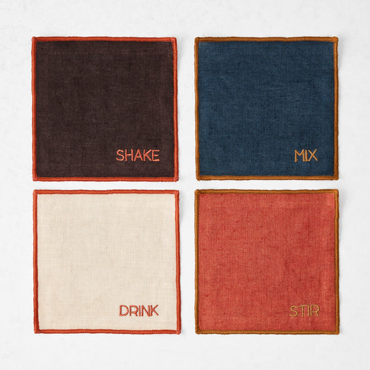 Set of four 5.5-inch square linen coasters in brown, navy, khaki, and brick with embroidered bar-themed text and stitched edges.