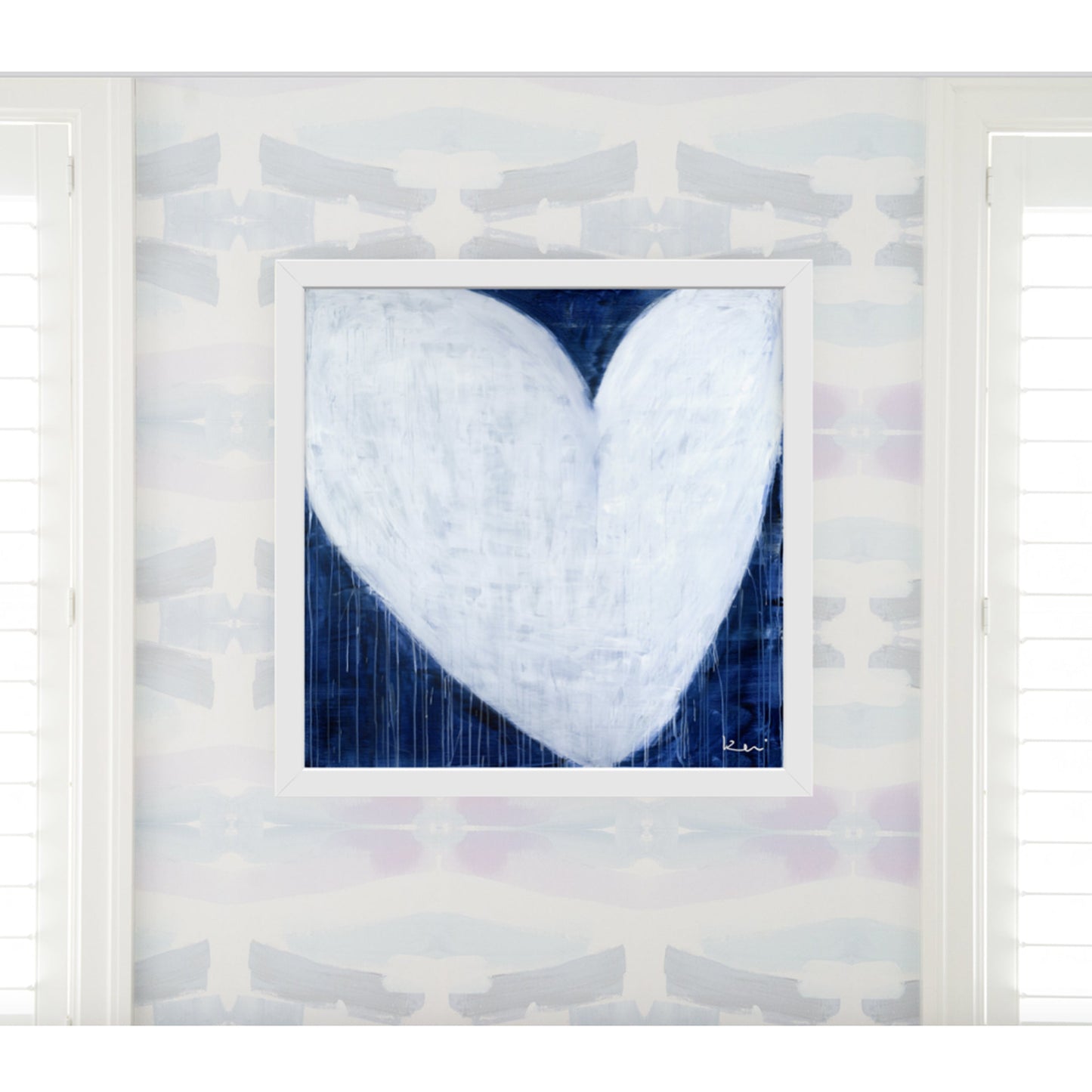 Kerri Rosenthal "She Will Be Loved" drippy white heart art print on indigo blue, framed in white.