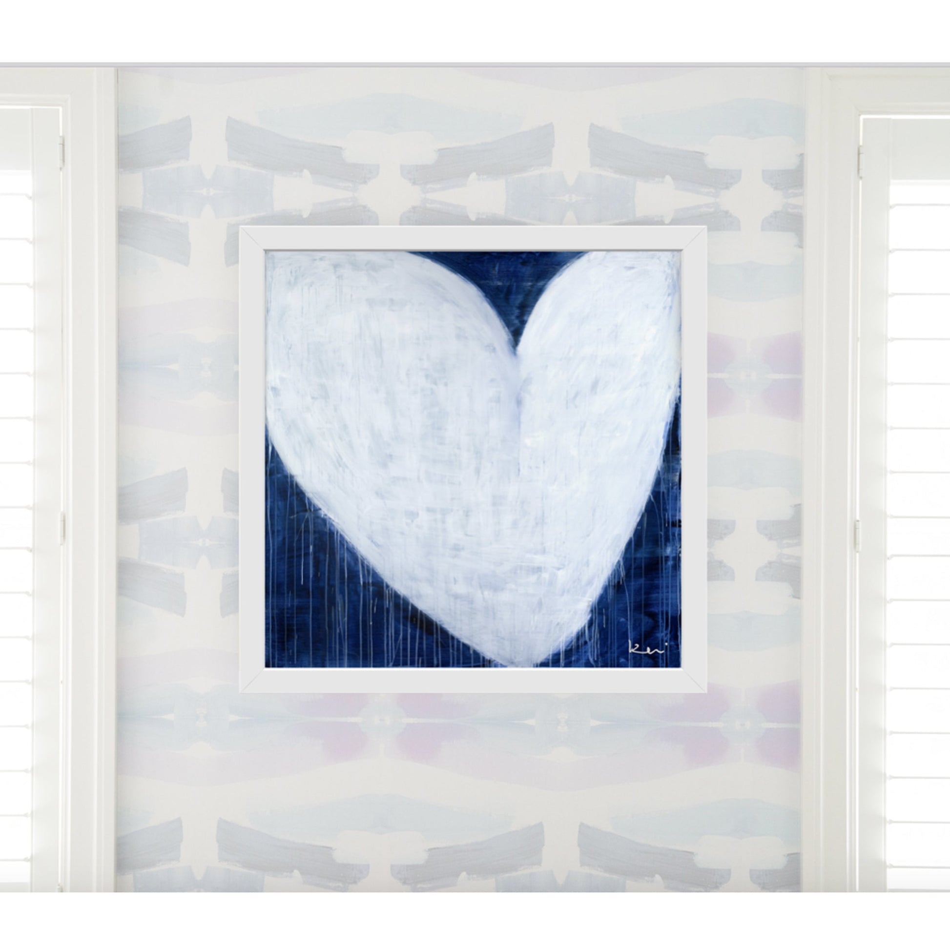 Kerri Rosenthal "She Will Be Loved" drippy white heart art print on indigo blue, framed in white.