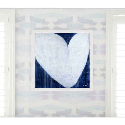 Kerri Rosenthal "She Will Be Loved" drippy white heart art print on indigo blue, framed in white.
