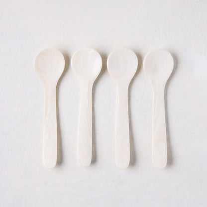 Set of 4 hand-carved Mother of Pearl caviar spoons, 3.25"L, with unique natural variations.