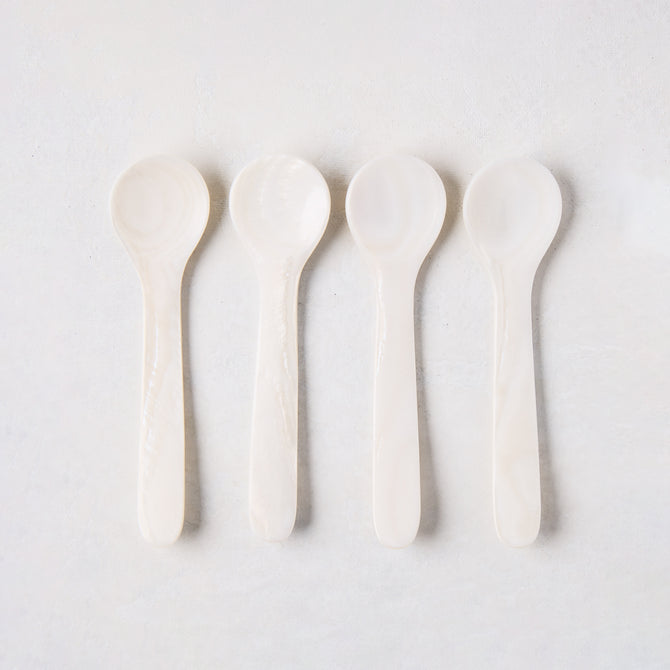 Set of 4 hand-carved Mother of Pearl caviar spoons, 3.25"L, with unique natural variations.