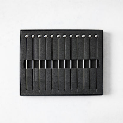 Set of 12 short 4" stainless steel cocktail picks with ball tops, displayed in a black box.