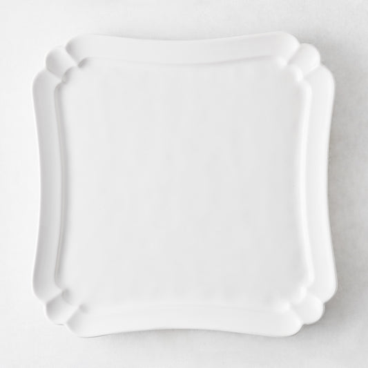13-inch square white ceramic serve platter with a scalloped edge, made in Italy.
