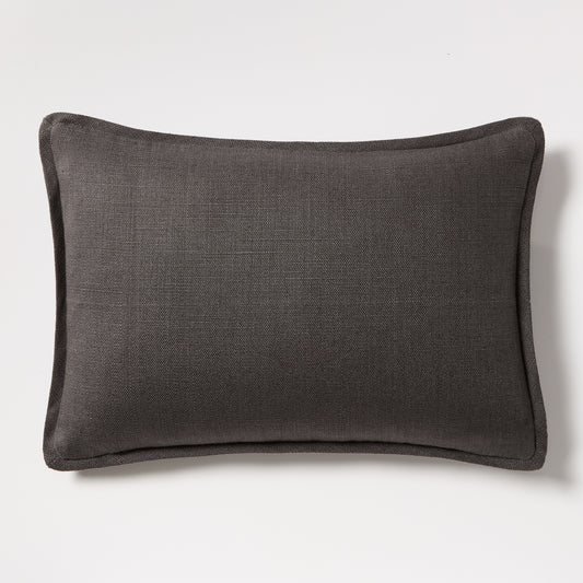 Slate grey tonal reversible velvet and linen lumbar pillow, 20"L x 14"H, with piped edges.