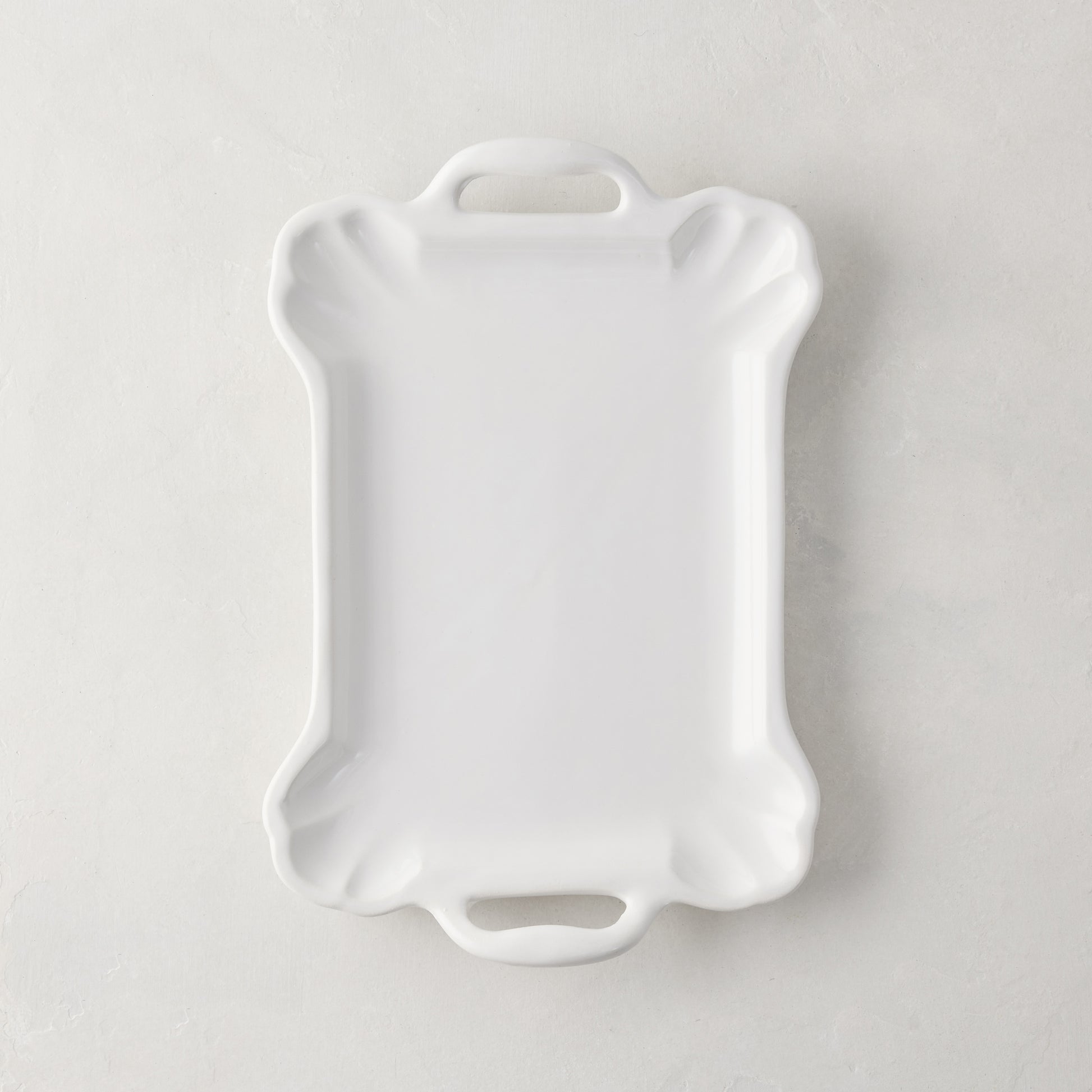 Small Alessia white ceramic handled serving platter with a delicate, vintage-inspired design and detailed edge.