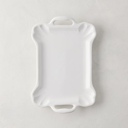 Small Alessia white ceramic handled serving platter with a delicate, vintage-inspired design and detailed edge.