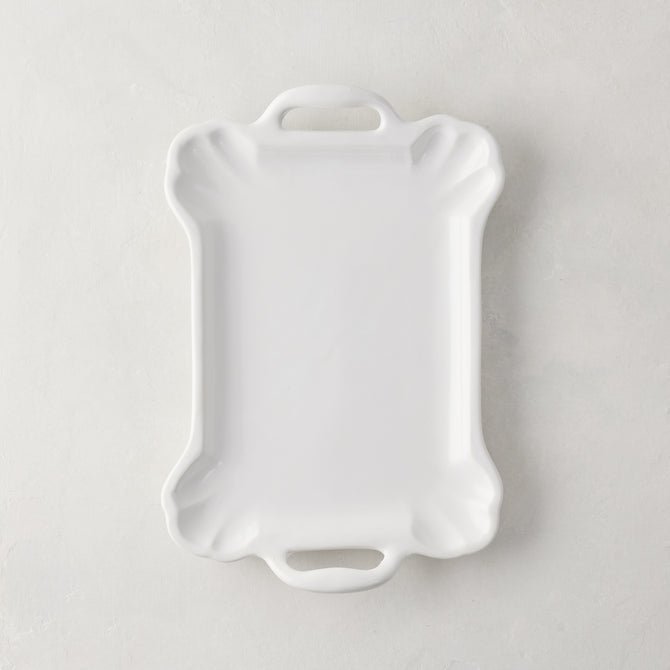 Small Alessia white ceramic handled serving platter with a delicate, vintage-inspired design and detailed edge.