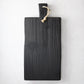 Small black reclaimed wood brasserie serving plank with a handle and twine loop.