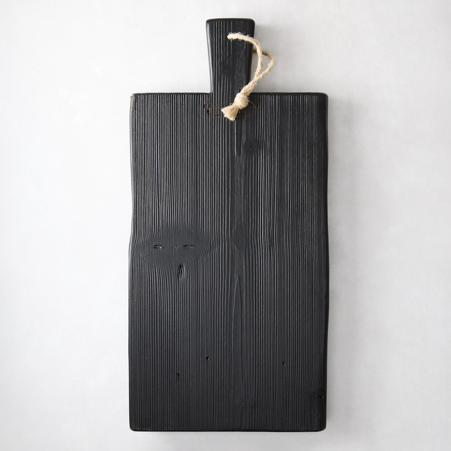 Small black reclaimed wood brasserie serving plank with a handle and twine loop.