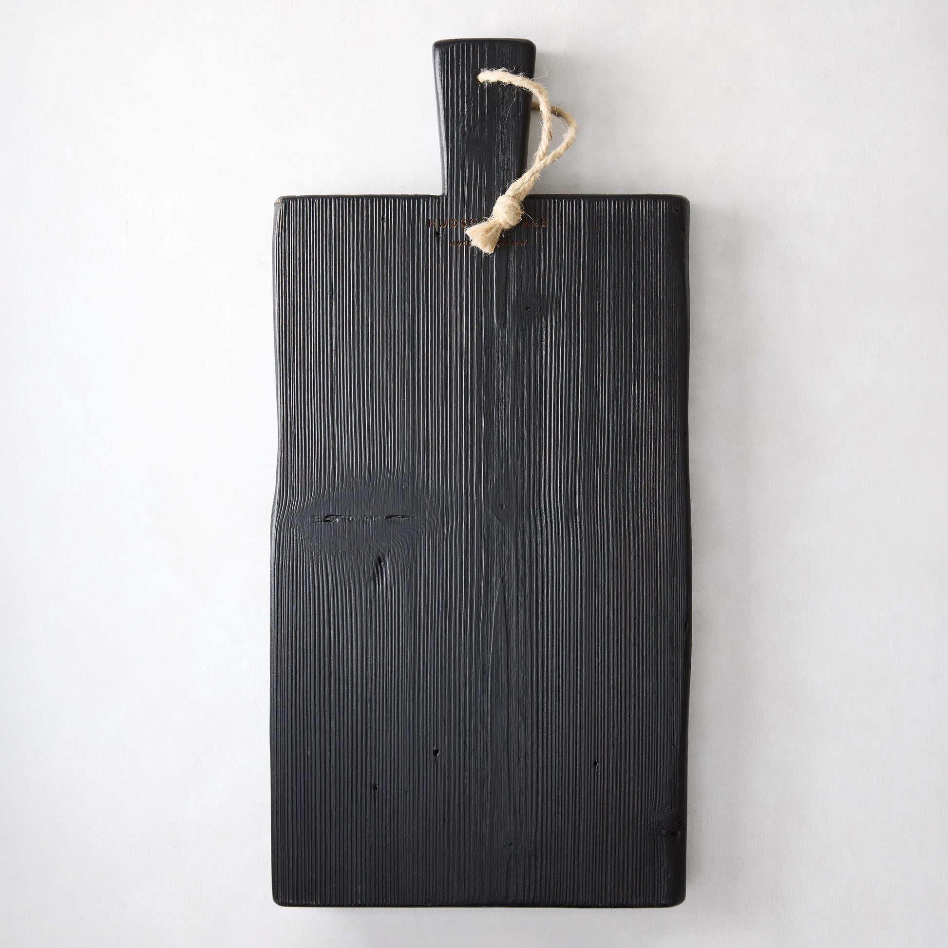 Small black reclaimed wood brasserie serving plank with a handle and twine loop.