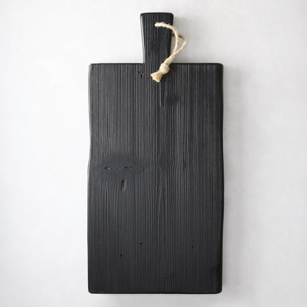 Small black reclaimed wood brasserie serving plank with a handle and twine loop.
