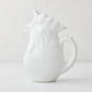 White ceramic rooster pitcher, 6.75"H, with a glossy glaze and detailed comb.