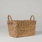 Small rectangular woven water hyacinth basket with two handles.