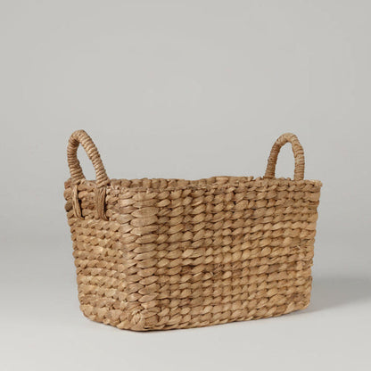 Small rectangular woven water hyacinth basket with two handles.