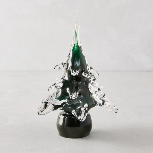 Handblown green glass Christmas tree, 7"H x 5.5"Dia, with clear textured branches and a dark base.
