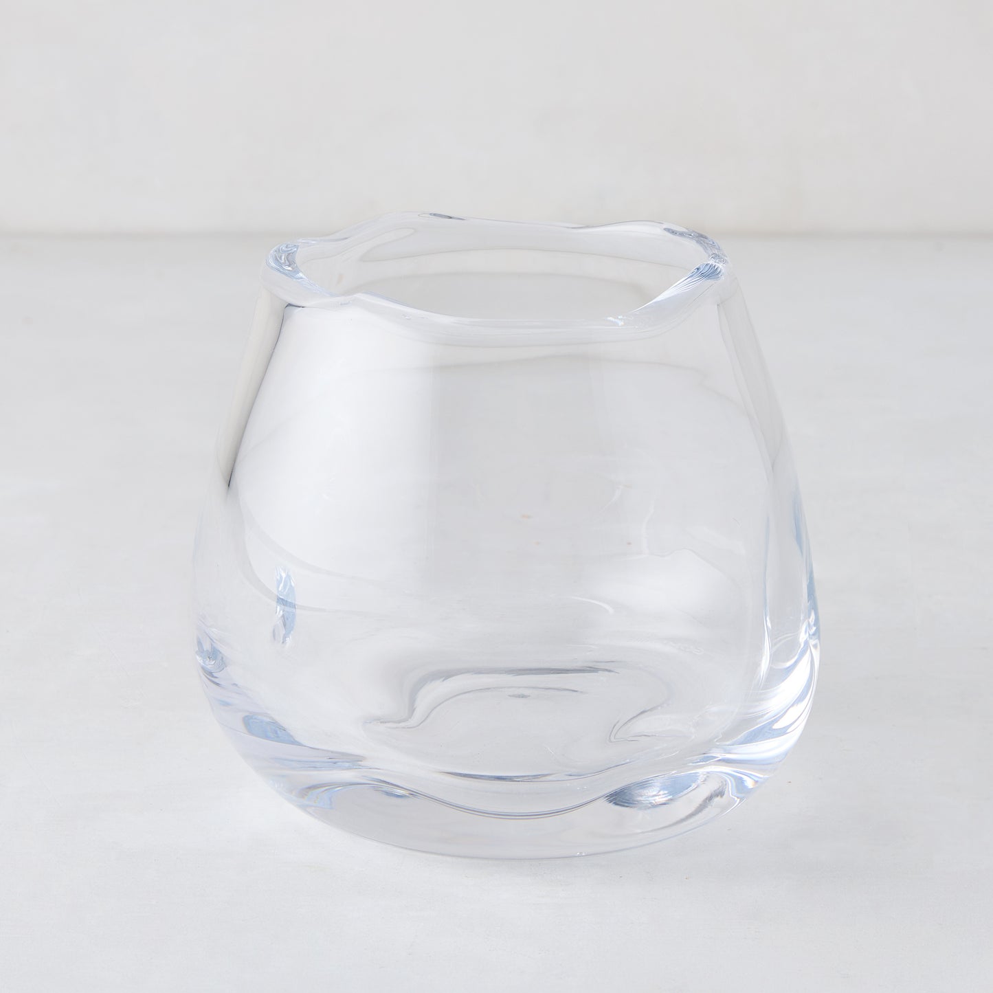Small Mia Scissor-Cut Round Vase, clear mouth-blown glass with a unique wavy rim.