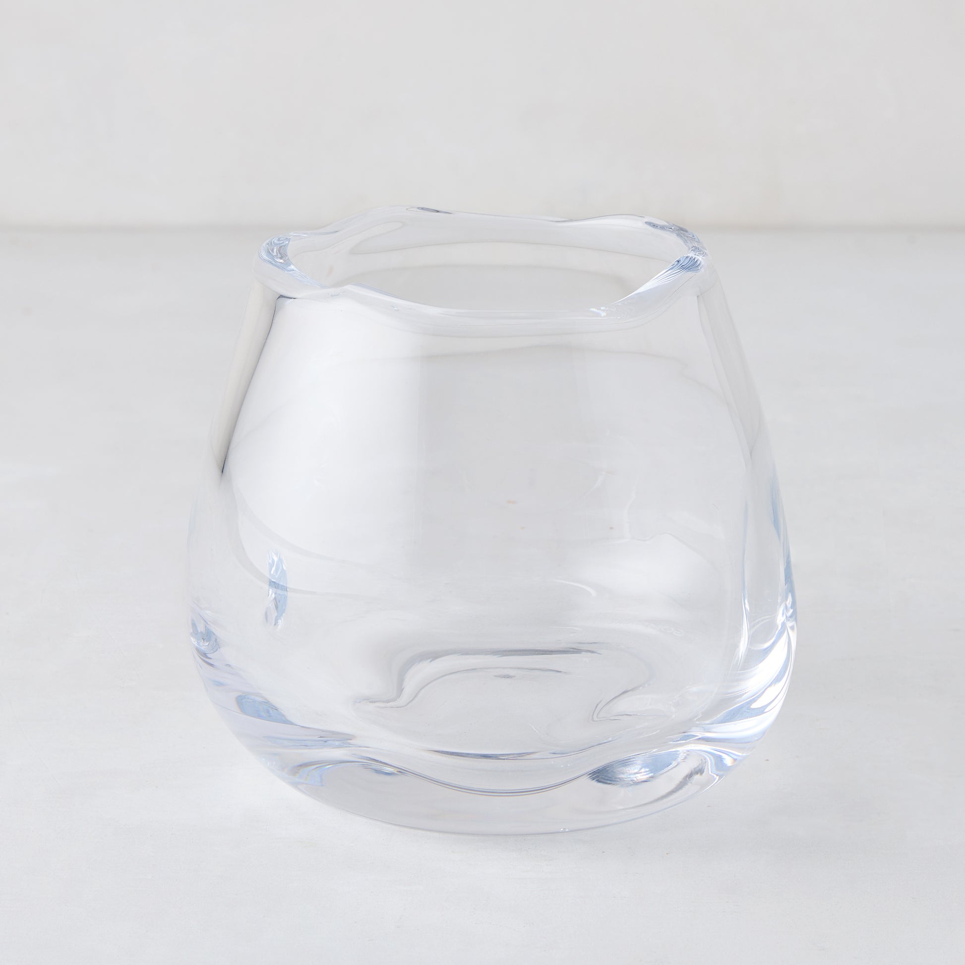 Small Mia Scissor-Cut Round Vase, clear mouth-blown glass with a unique wavy rim.