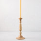 Small natural beechwood Georgian candlestick, 11"H, with a cream taper candle.
