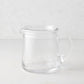 Small Oxford clear glass pitcher with a hand-molded rim and handle.