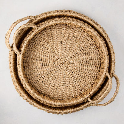 Small round woven abaca handled tray, natural brown, 16.5"Dia, with integrated handles.