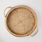 Small round woven abaca handled tray, natural brown, 16.5"Dia, with integrated handles and spiral weave.