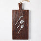 Dark European Pine wood plank serving board with three silver forged cheese knives.