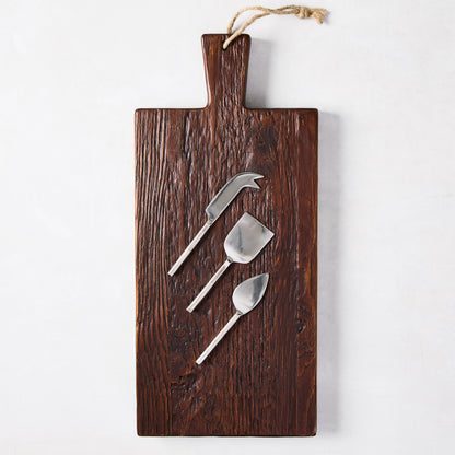 Dark European Pine wood plank serving board with three silver forged cheese knives.