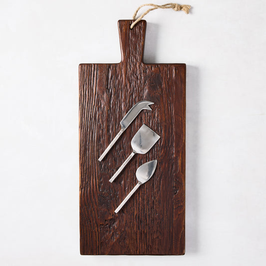 Dark European Pine wood plank serving board with three silver forged cheese knives.