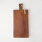 Small Saddle Wood Serving Plank, dark brown European pine, with a handle and rope hanger.