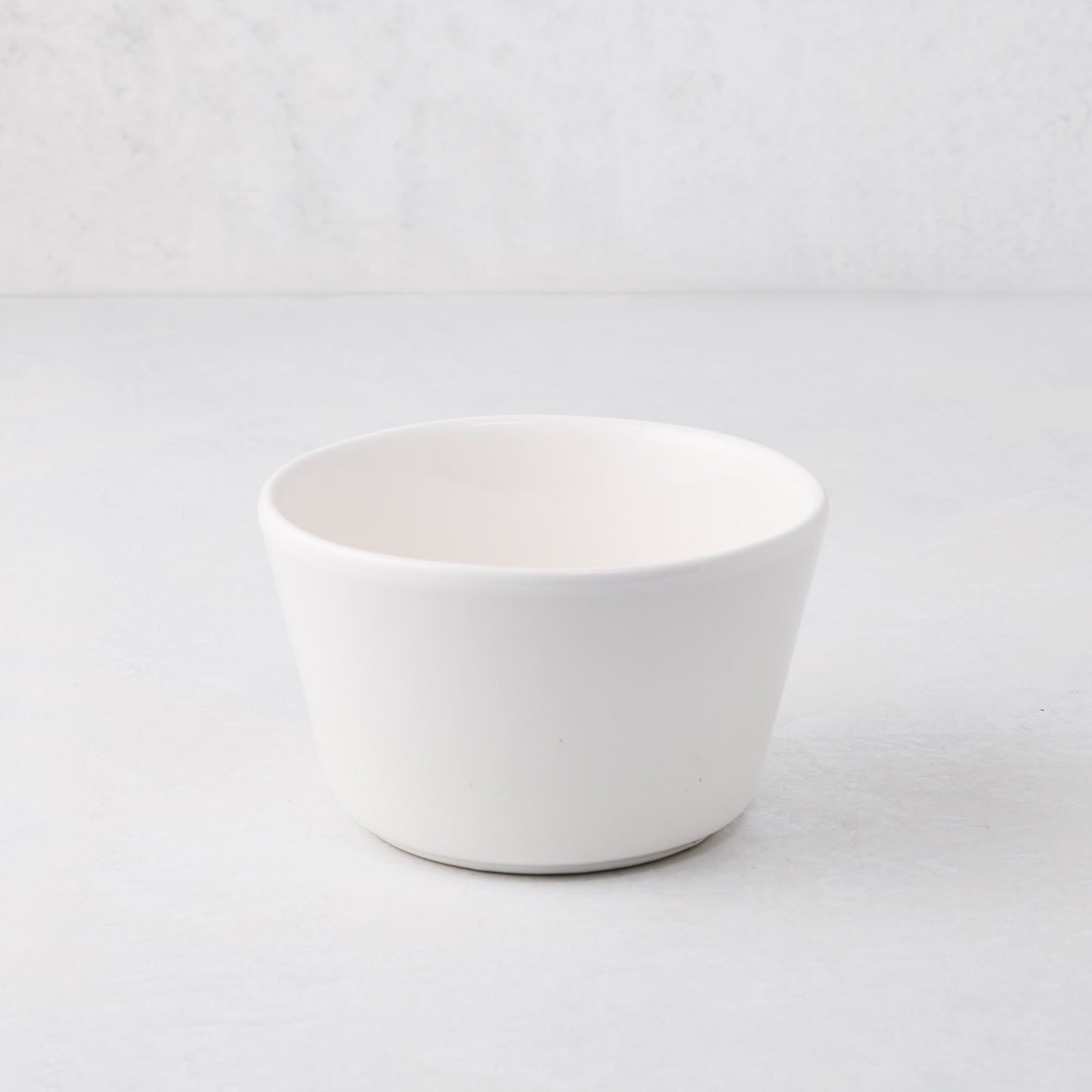 Small white spiral ceramic serve bowl, handmade in Portugal.