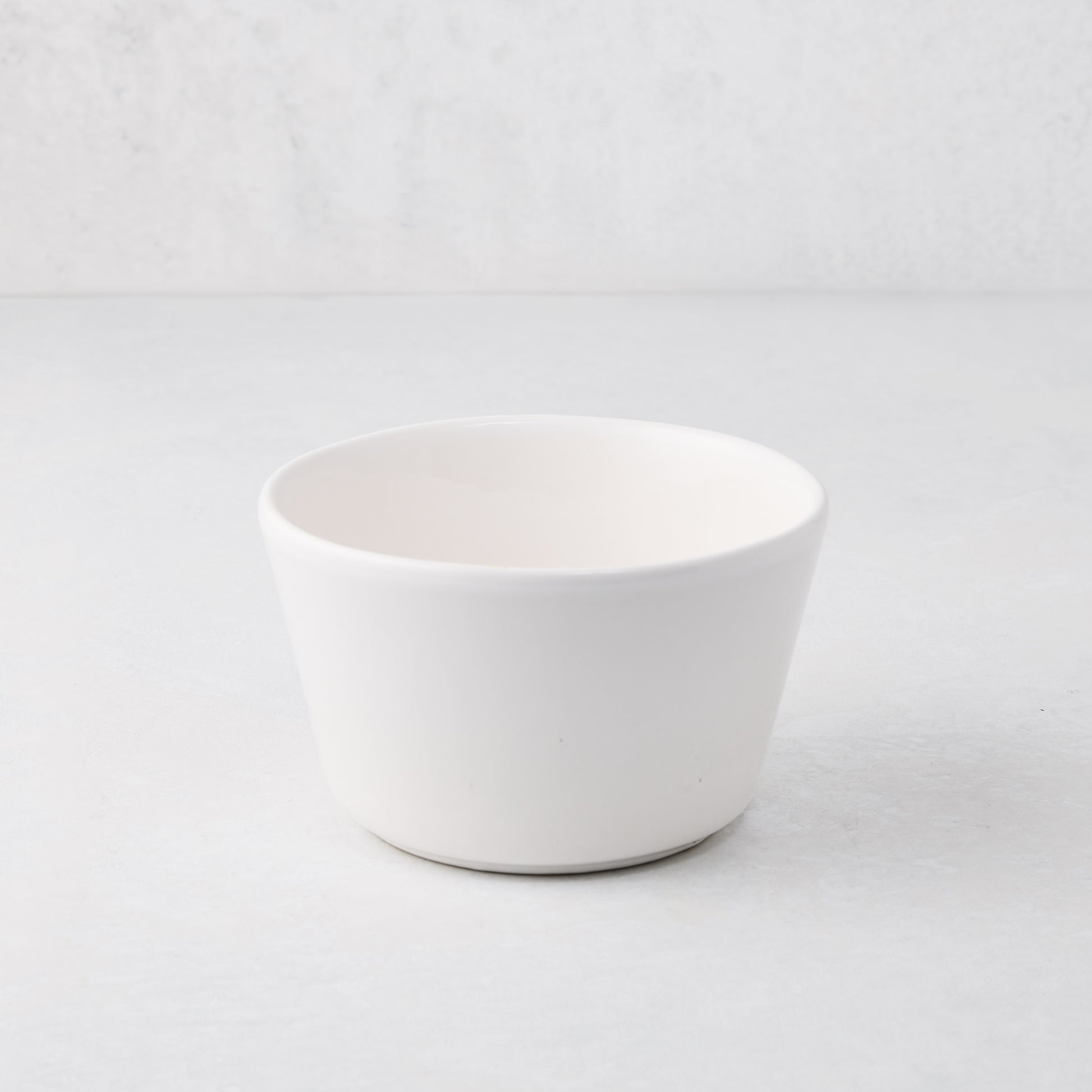Small white spiral ceramic serve bowl, handmade in Portugal.