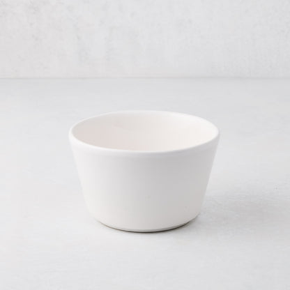 Small white spiral ceramic serve bowl, handmade in Portugal.