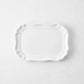 Small white ceramic Torcello serve platter with a scalloped edge, 11 by 8.4 inches, made in Italy.