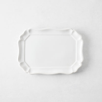 Small white ceramic Torcello serve platter with a scalloped edge, 11 by 8.4 inches, made in Italy.