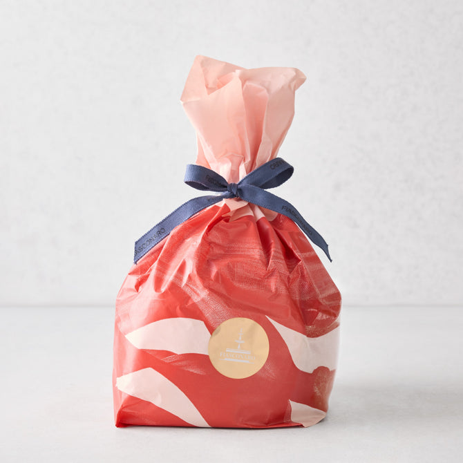 Hudson Grace Fiasconaro small panettone wrapped in red and white patterned paper with a blue ribbon tie