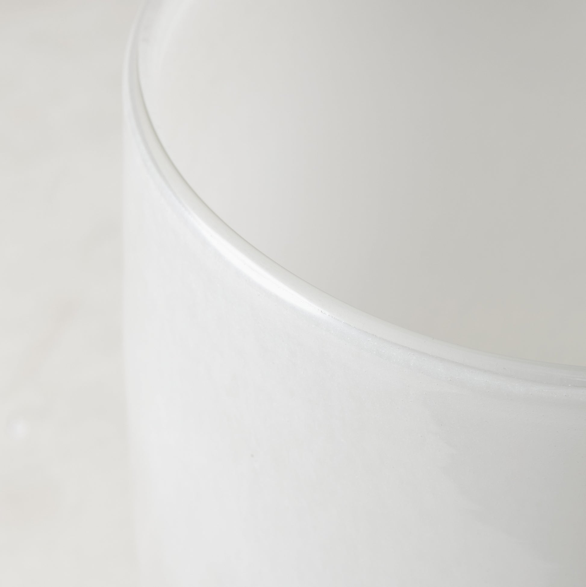 Small opaque white handblown glass barrel vase, 5.3"H x 3.9"W.