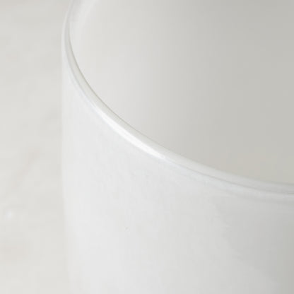 Small opaque white handblown glass barrel vase, 5.3"H x 3.9"W.