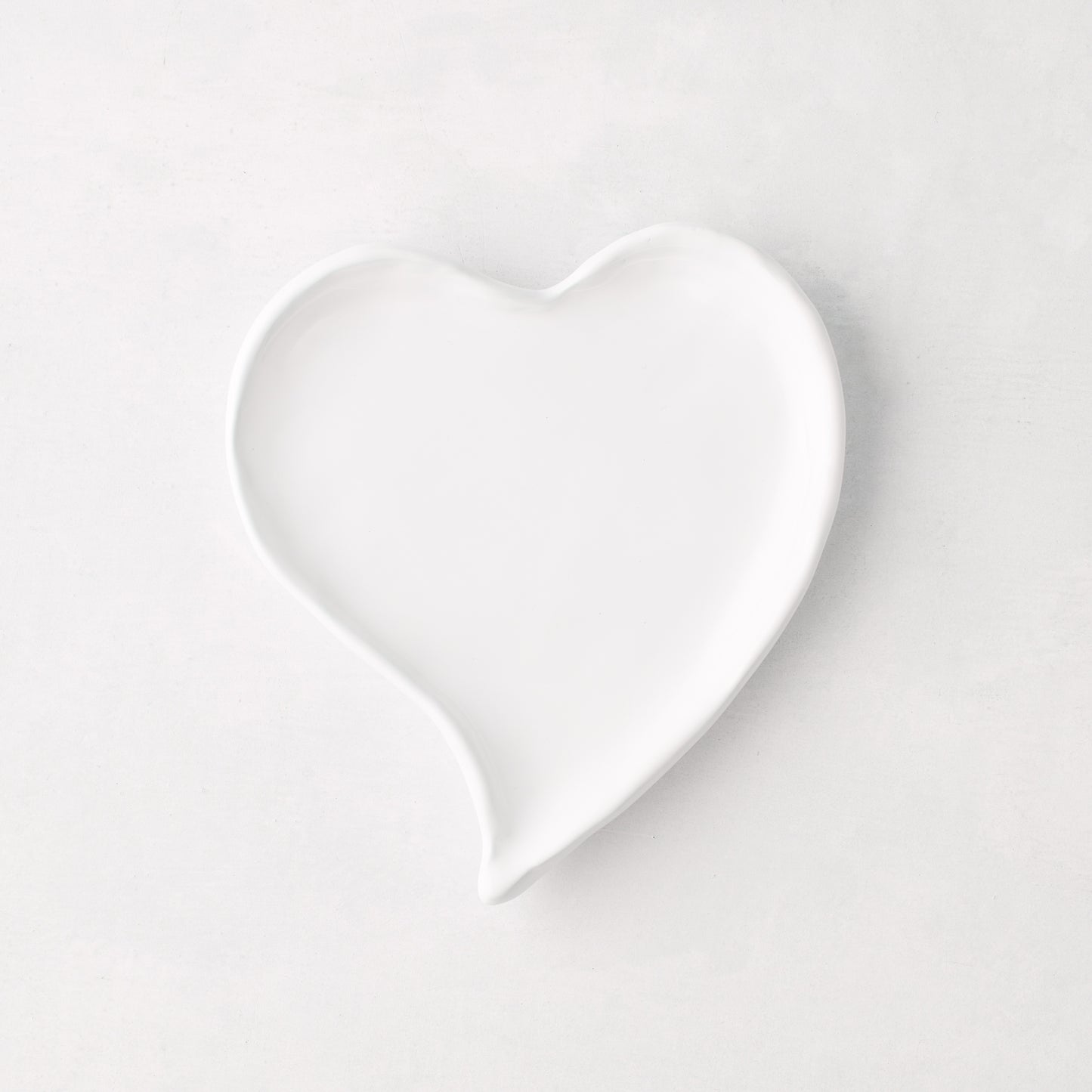 Small white ceramic heart-shaped dish, handmade in Italy.
