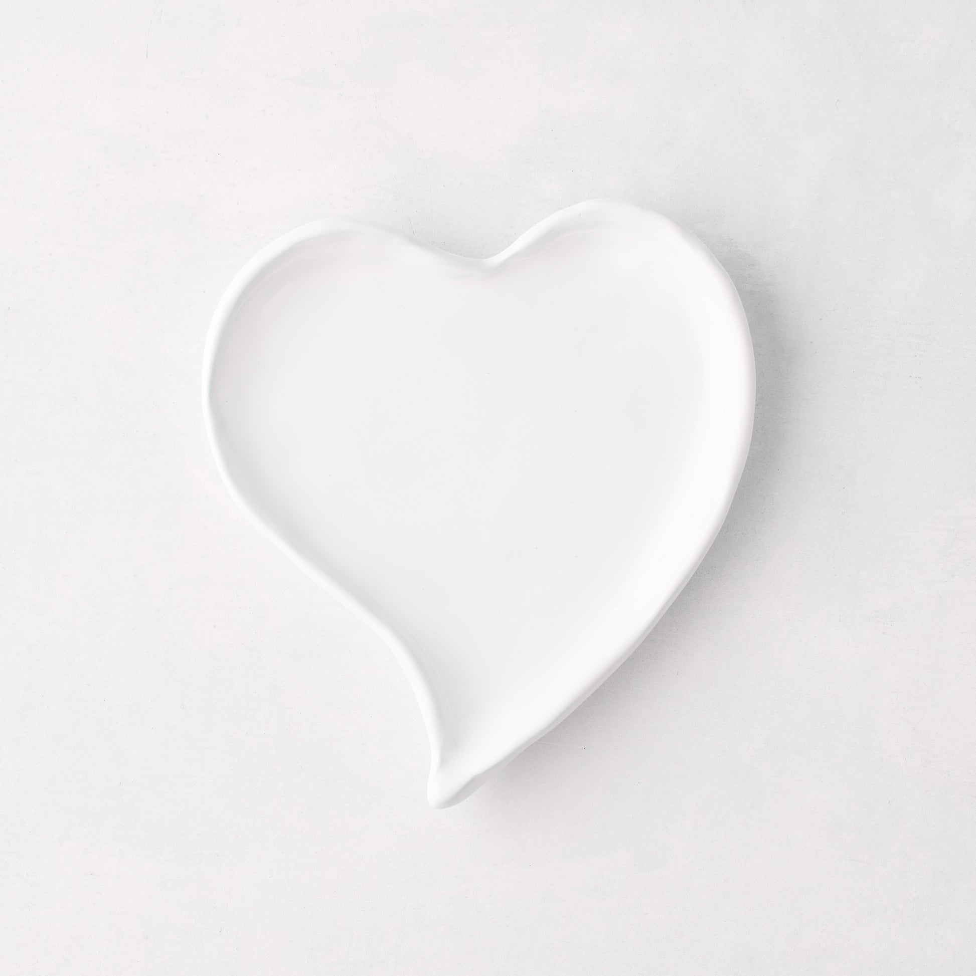 Small white ceramic heart-shaped dish, handmade in Italy.