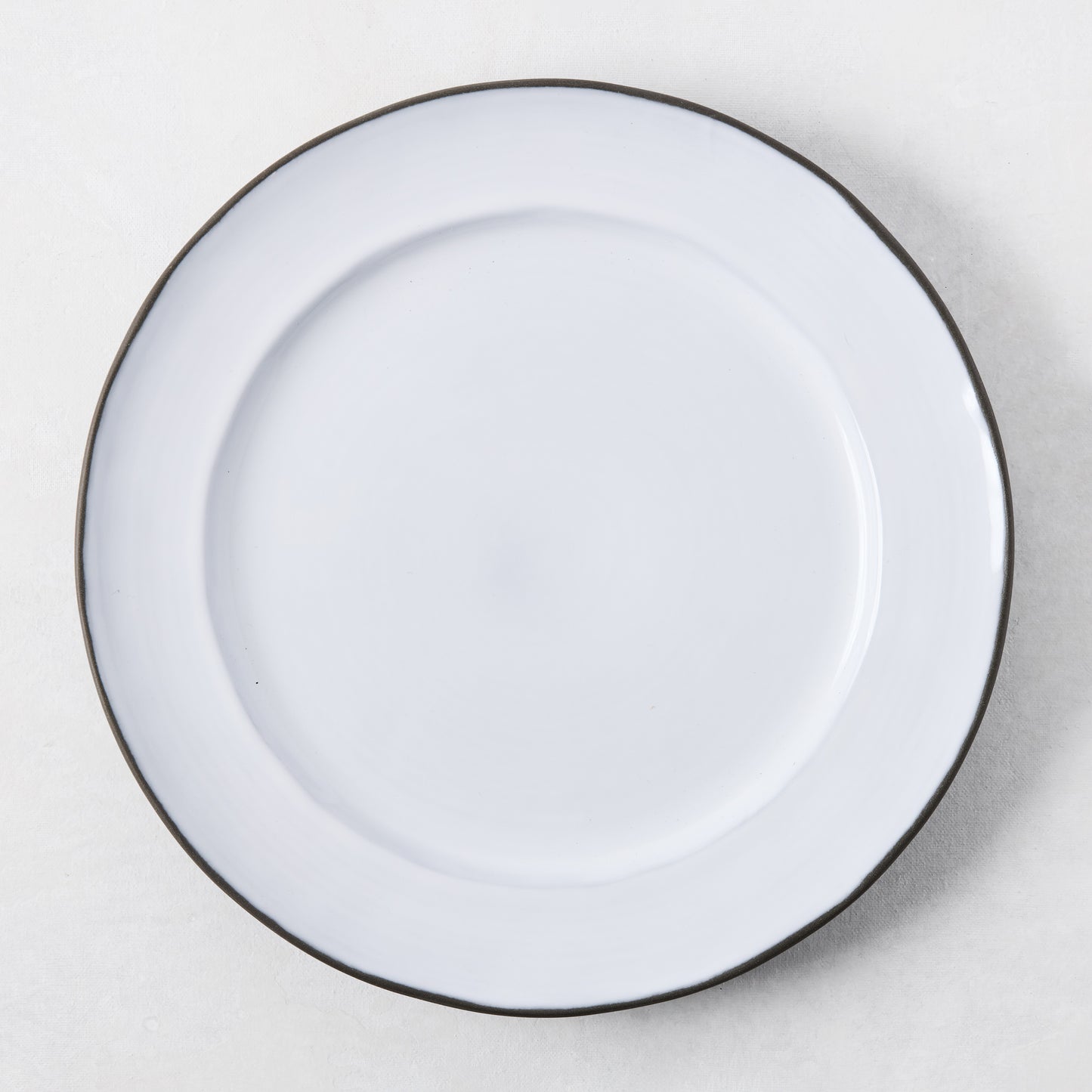 Smoke Grey Stoneware Dinner Plate, 11.3"Dia, with dark grey rim and light grey glazed center.