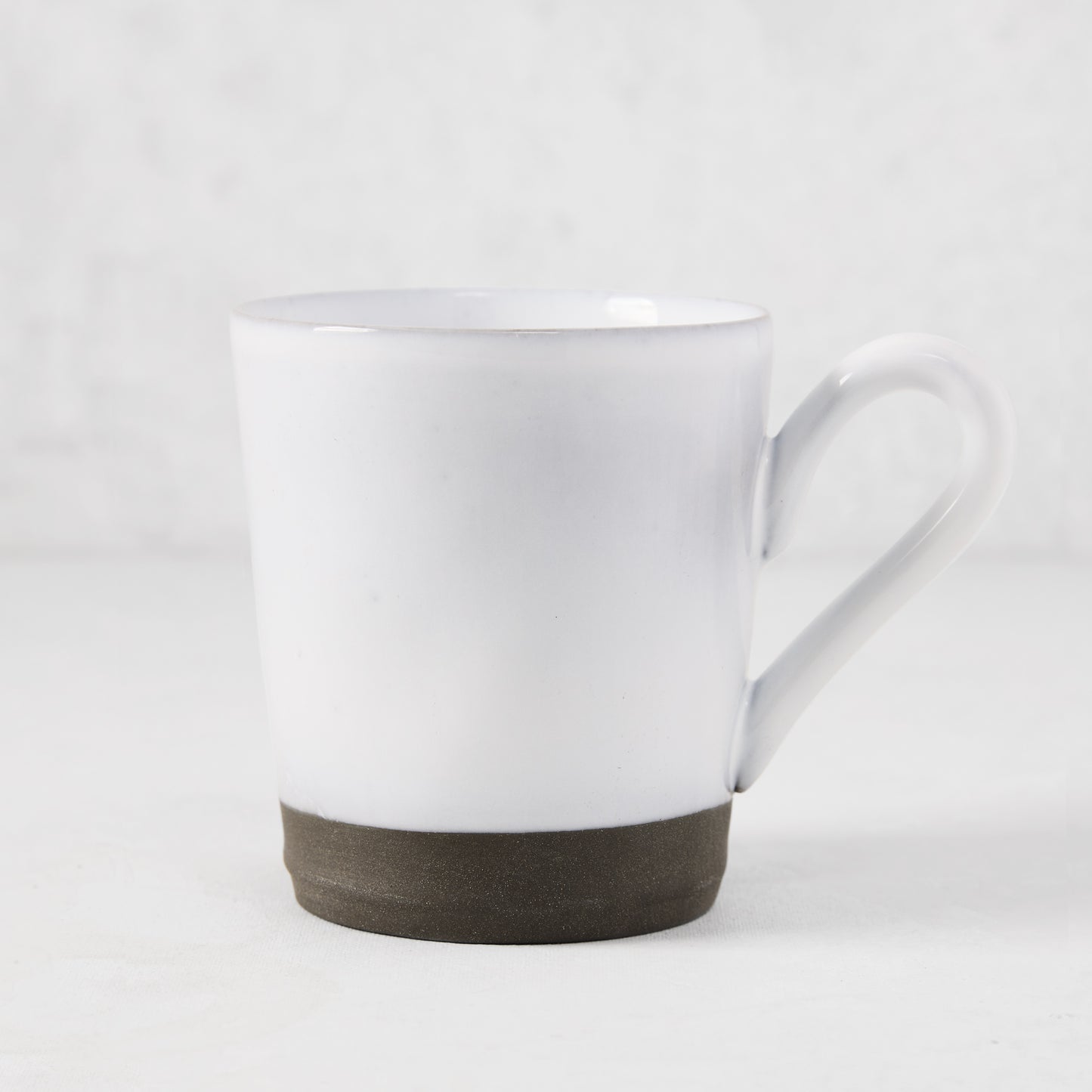Smoke Grey Stoneware Mug, 12oz, with light grey glazed top and dark grey unglazed base.