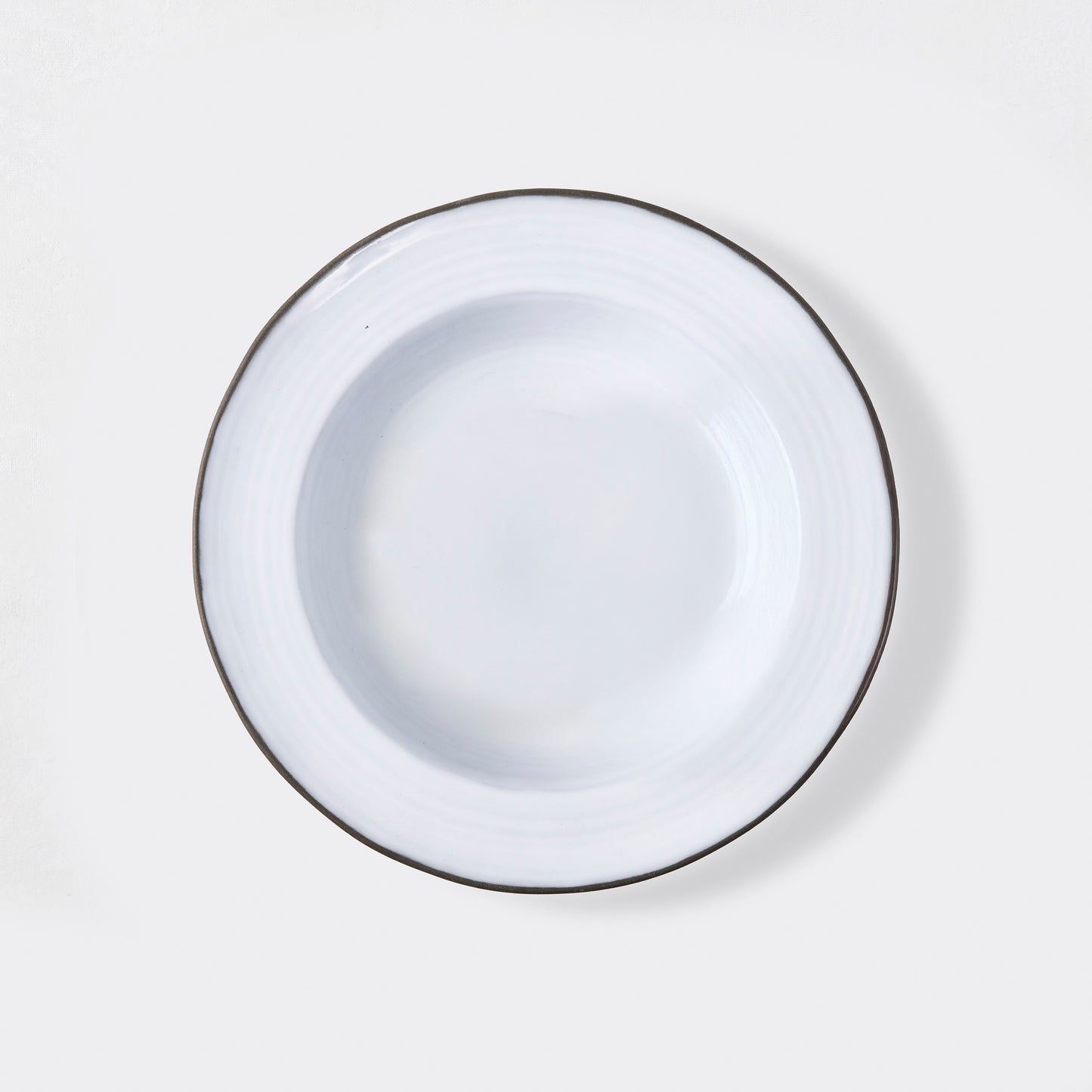 Smoke Grey Stoneware Soup Bowl, 8.5"Dia, with a dark rim and light grey glazed interior.